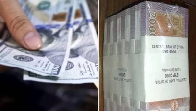 تراجع بسيط لليرة السورية أمام الدوﻻر